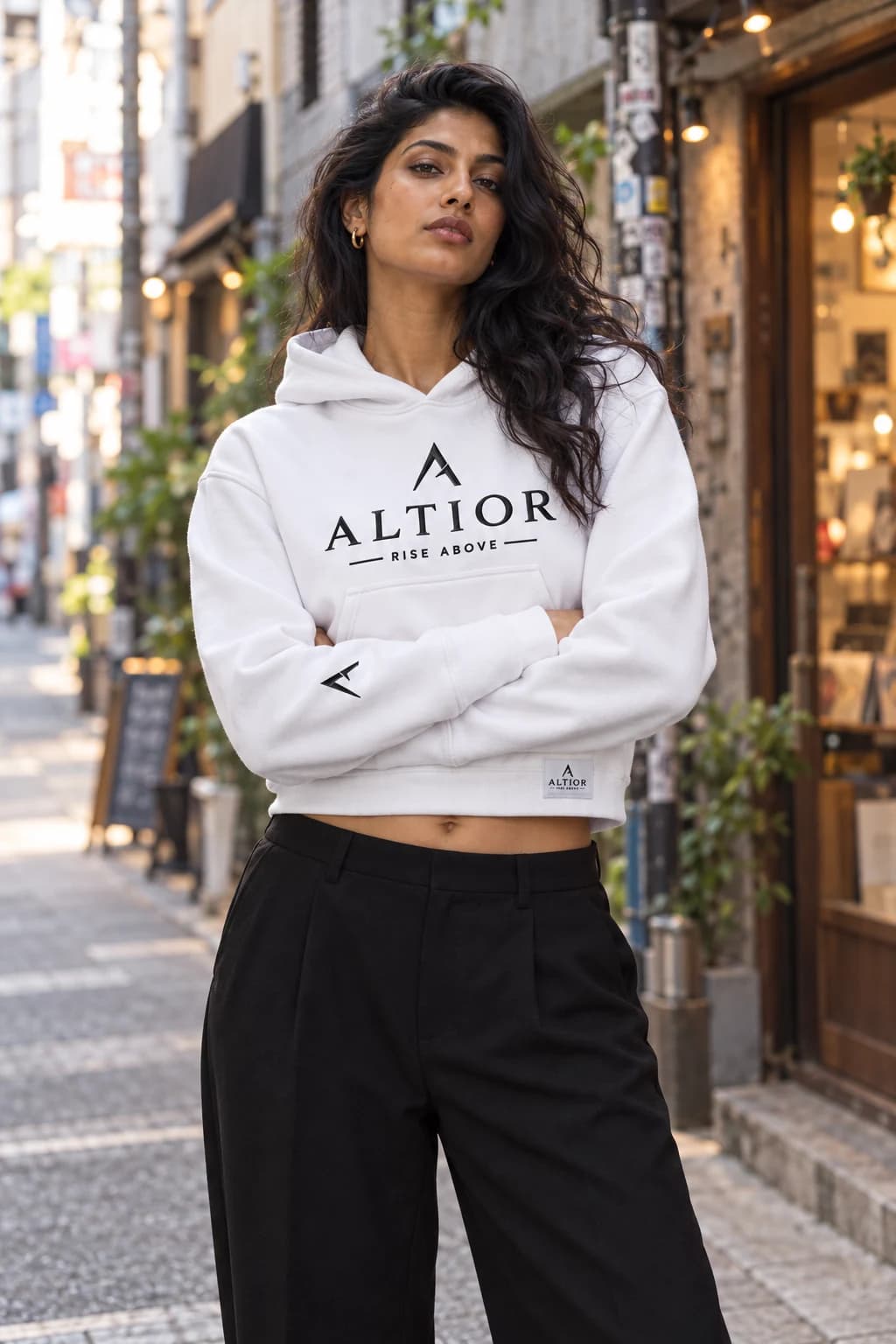 Generated ALTIOR editorial: adult woman wearing ghost white elevate crop hoodie in a Shimokitazawa-inspired setting.