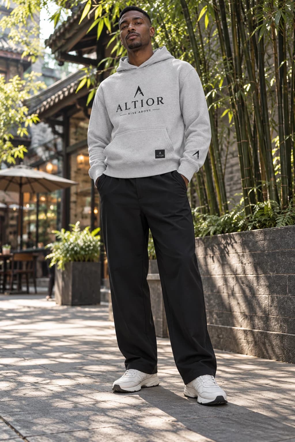 Generated ALTIOR editorial: adult man wearing carbon ash summit hoodie in a Chengdu streets-inspired setting.