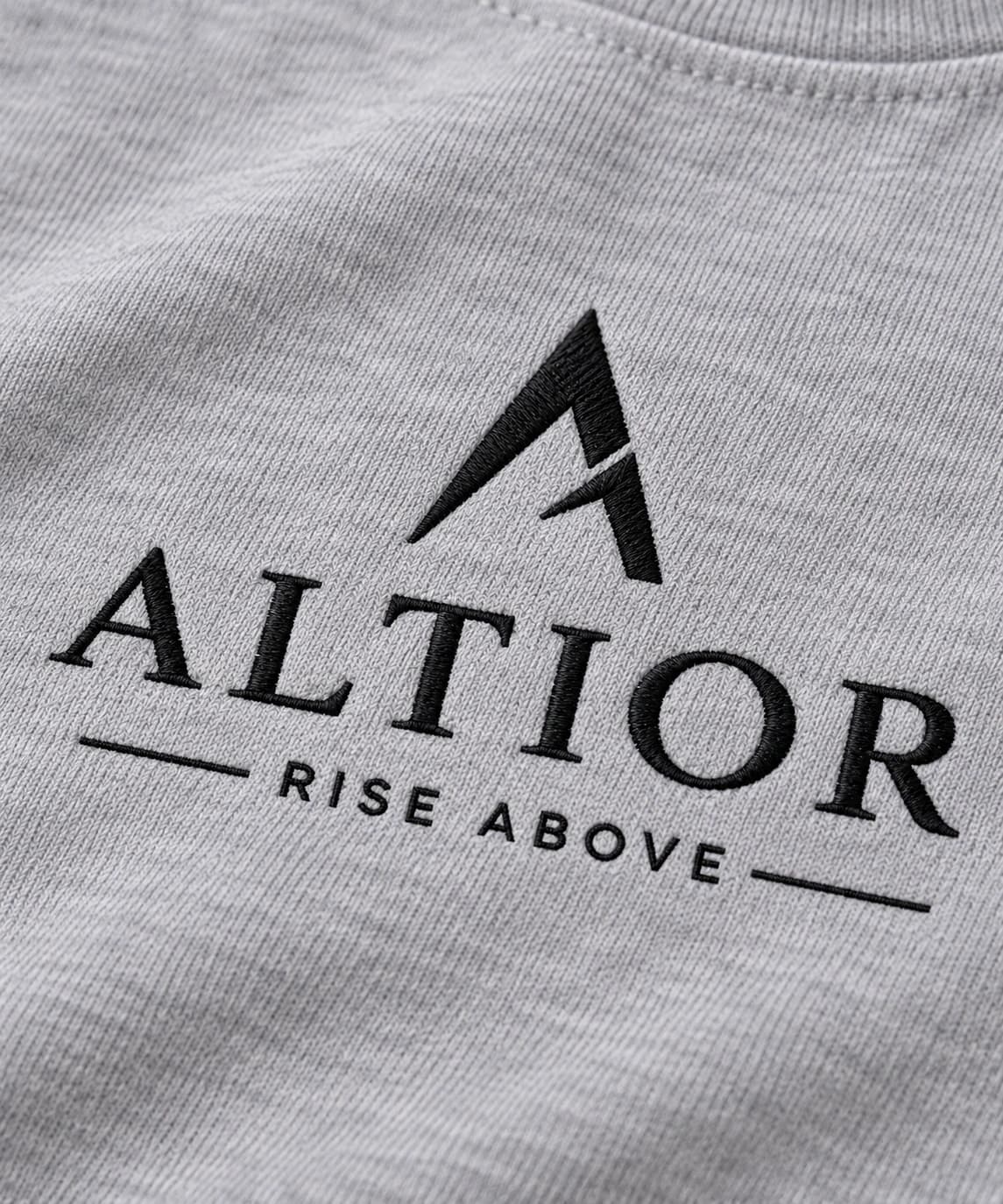 Cropped tee — Grey with black detailing, AI-generated embroidered branding close-up
