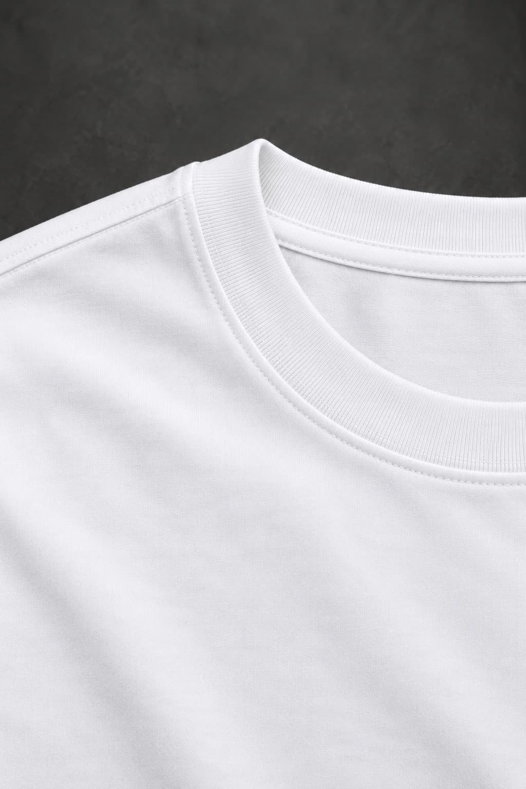 Signature tee — White with black detailing, AI-generated fabric and seam close-up study