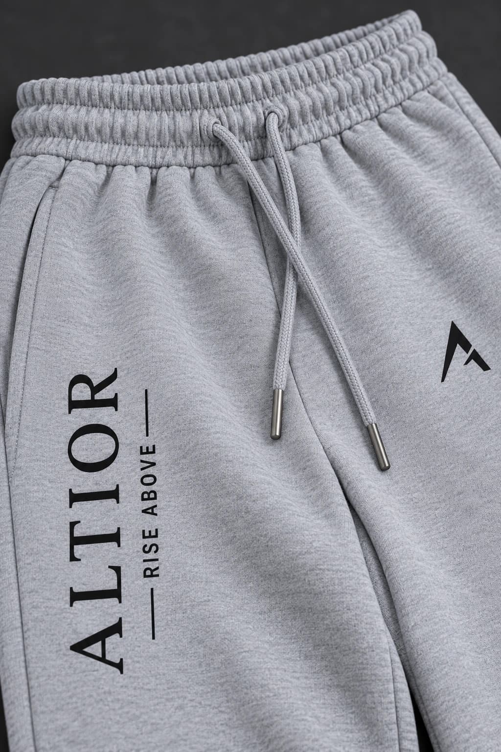 Track pants — Grey with black detailing, AI-generated fabric and seam close-up study