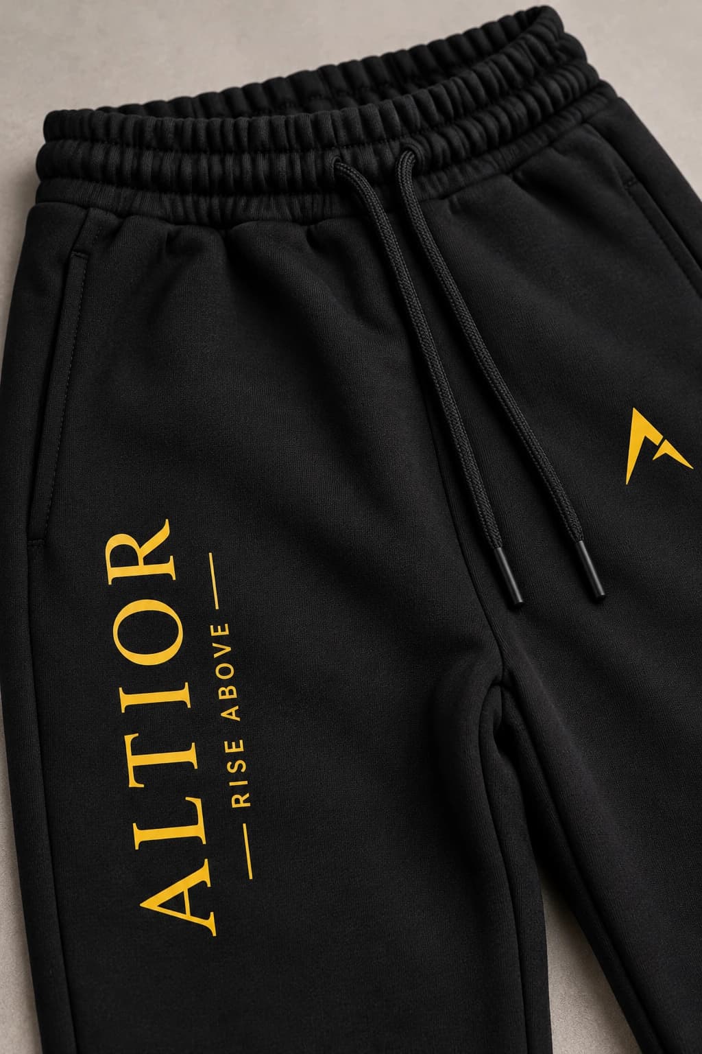 Track pants — Black with gold detailing, AI-generated fabric and seam close-up study