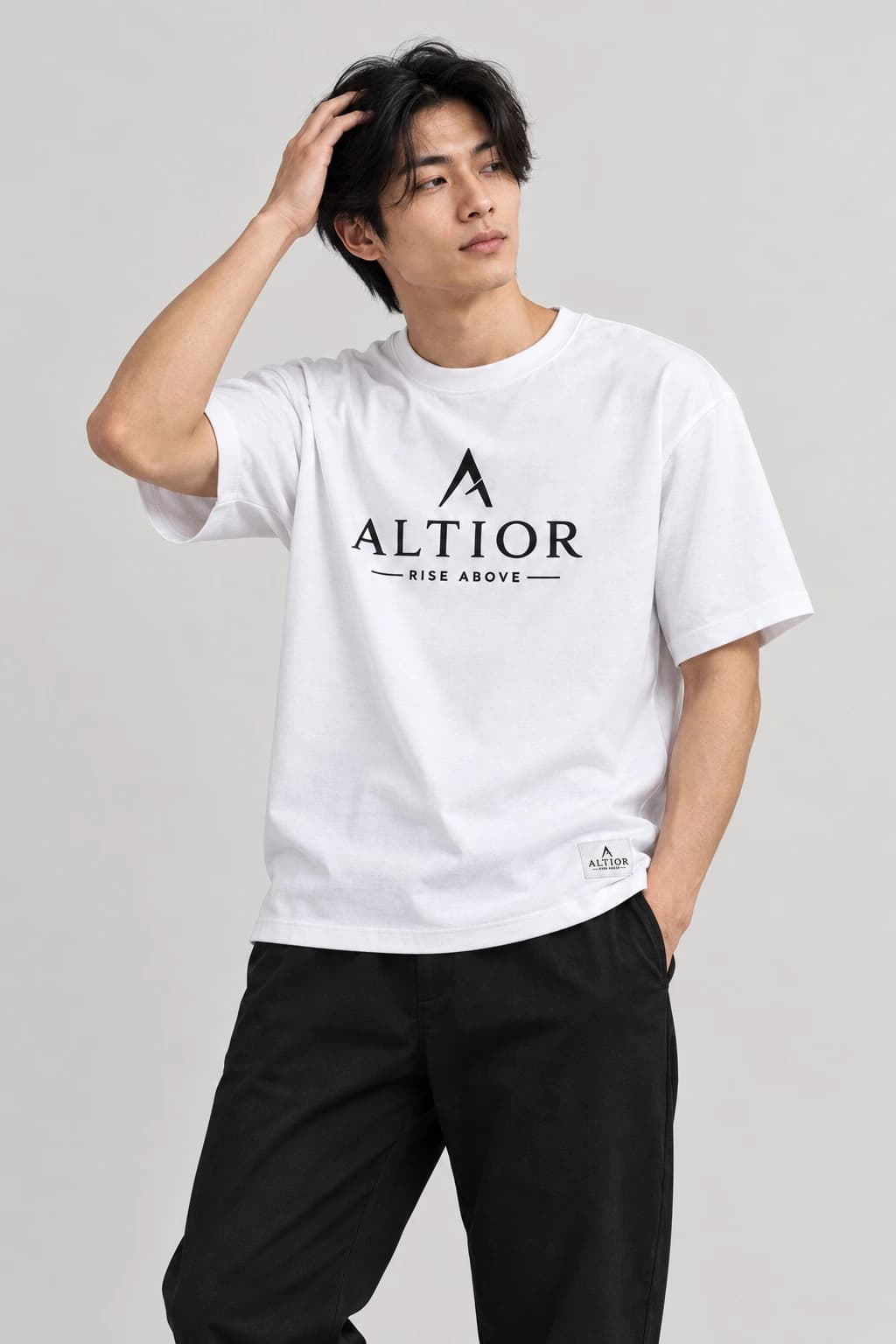 Signature tee — White with black detailing, front view on male model