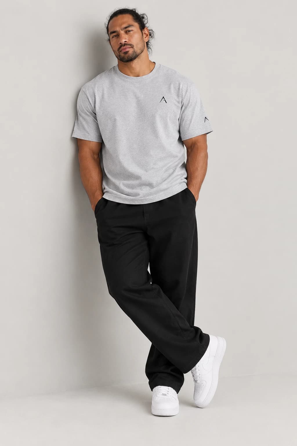 Core tee — Grey with black detailing, front view on male model