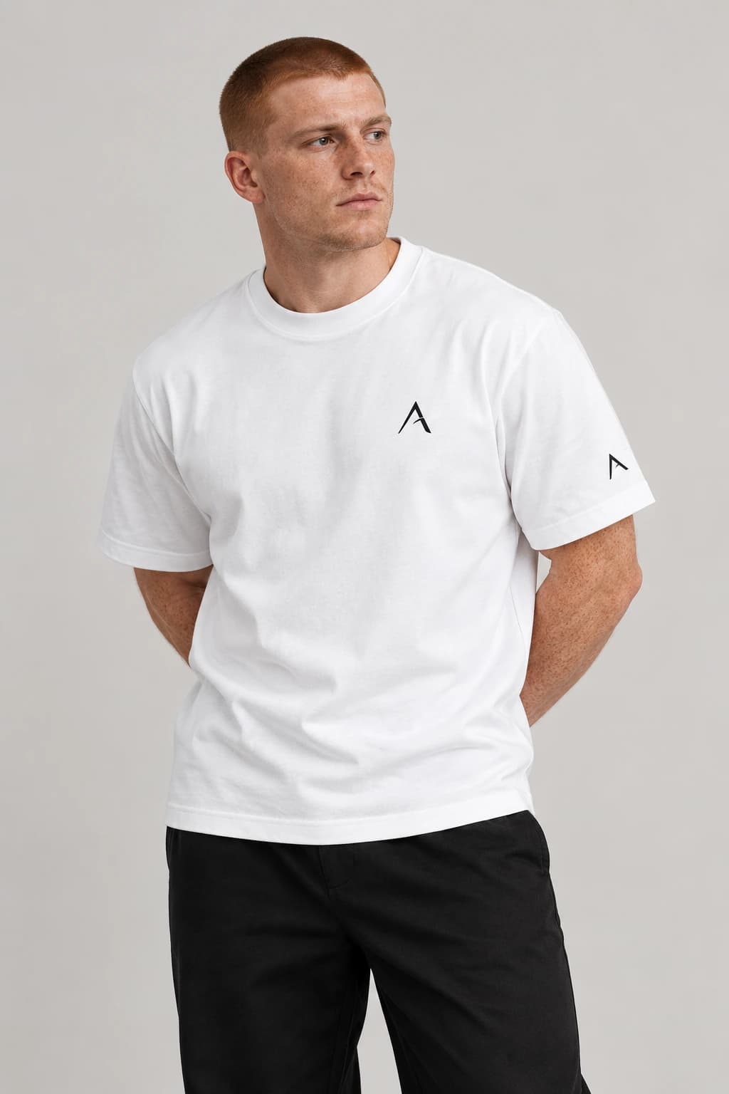 Core tee — White with black detailing, front view on male model