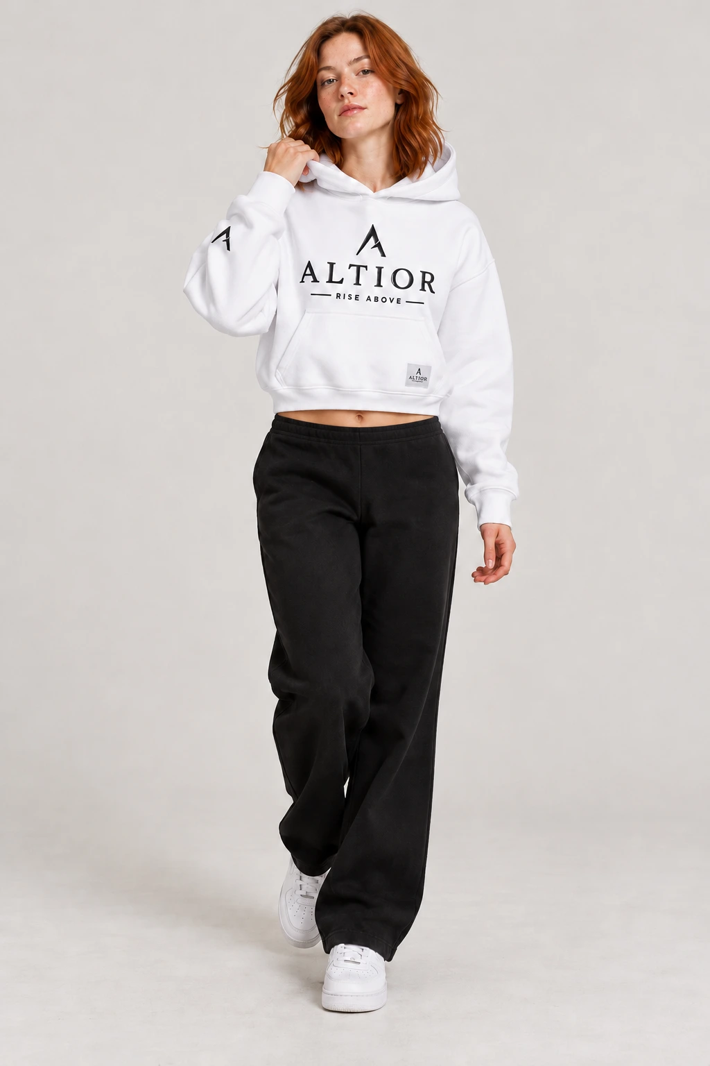 Cropped hoodie — White with black detailing, front view on female model