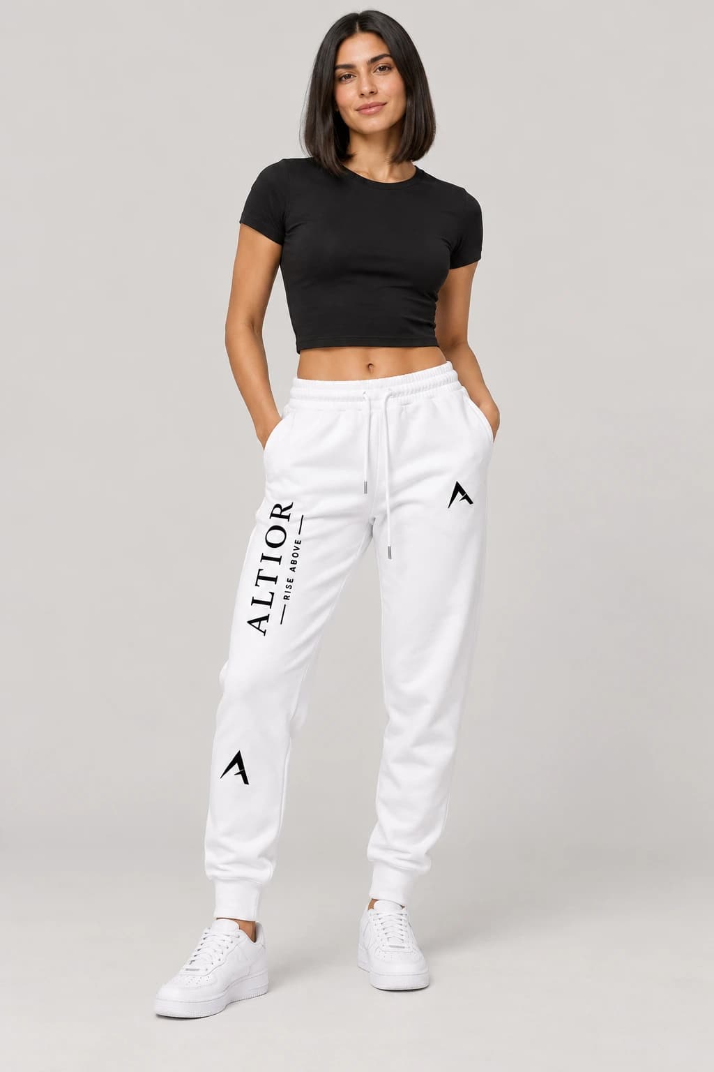 Track pants — White with black detailing, track pants on female model