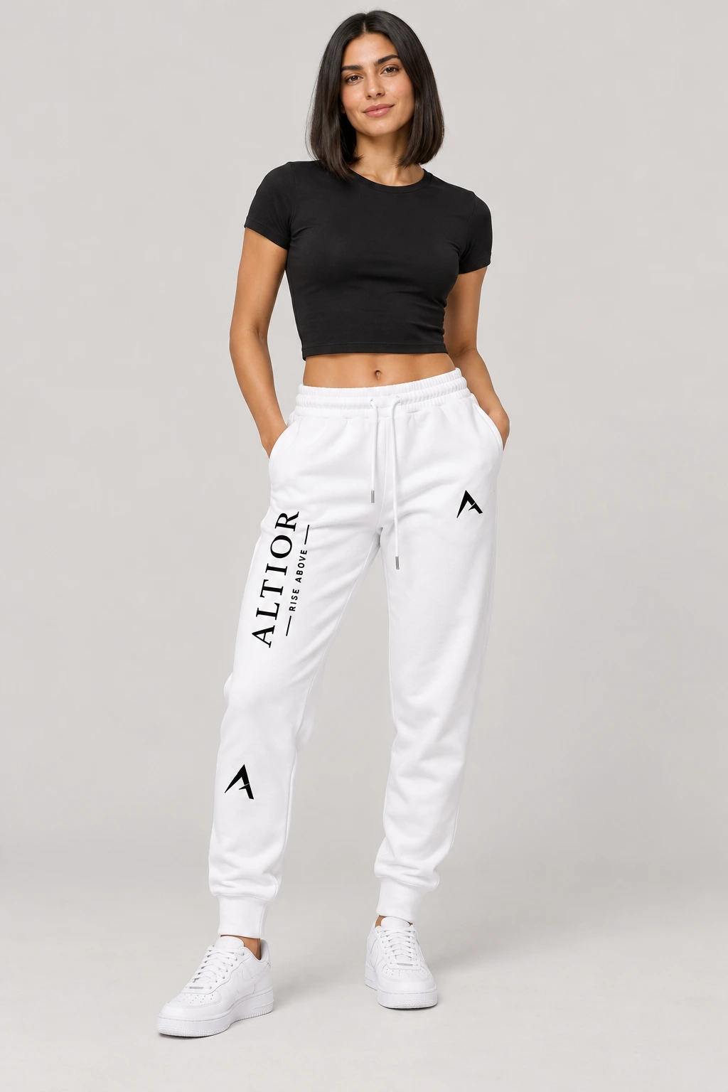 Track pants — White with black detailing, track pants on female model