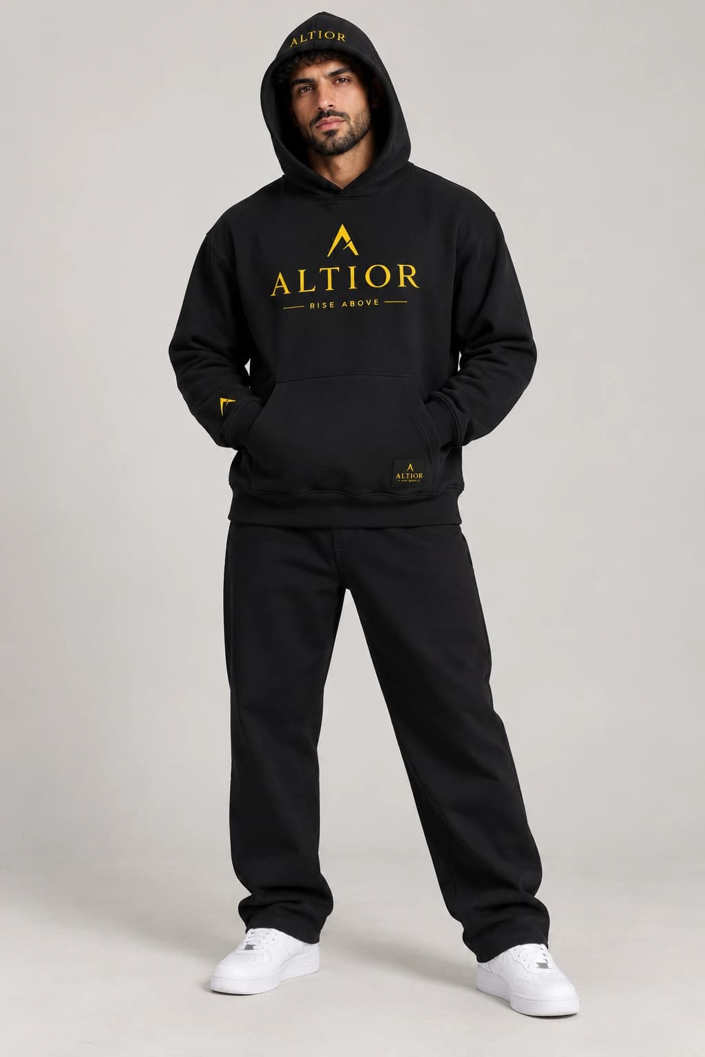 500 GSM hoodie — Black with gold detailing, front view on male model